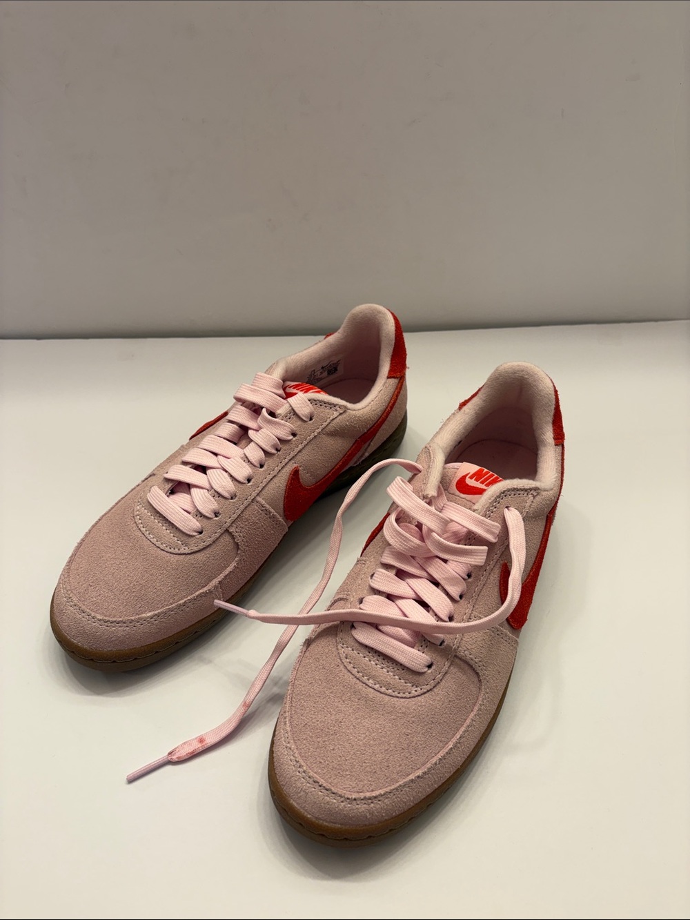 Nike Women’s Pink Suede Sneakers with Red Swoosh